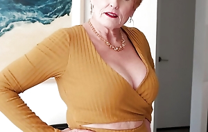 A busty GILF and the brush toy