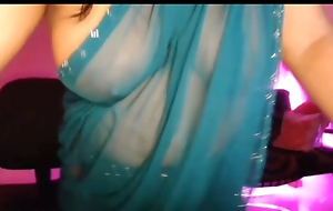 Bhabhi, crazy with reference to the juice of hawt youth, is enjoying by opening her brassiere together with showing her boobs through the saree.